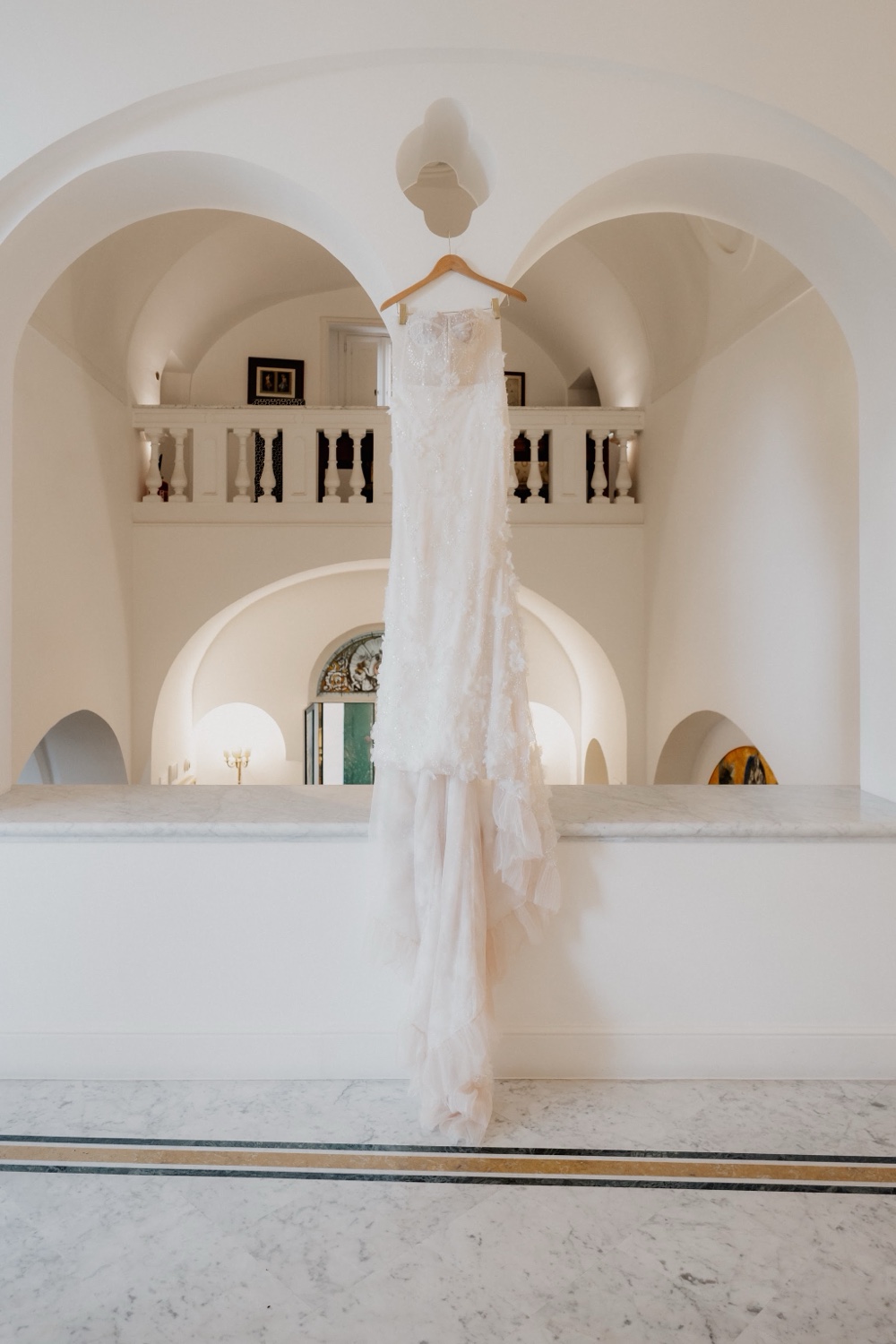 A bride in an arched white hall at Palazzo Avino in Ravello