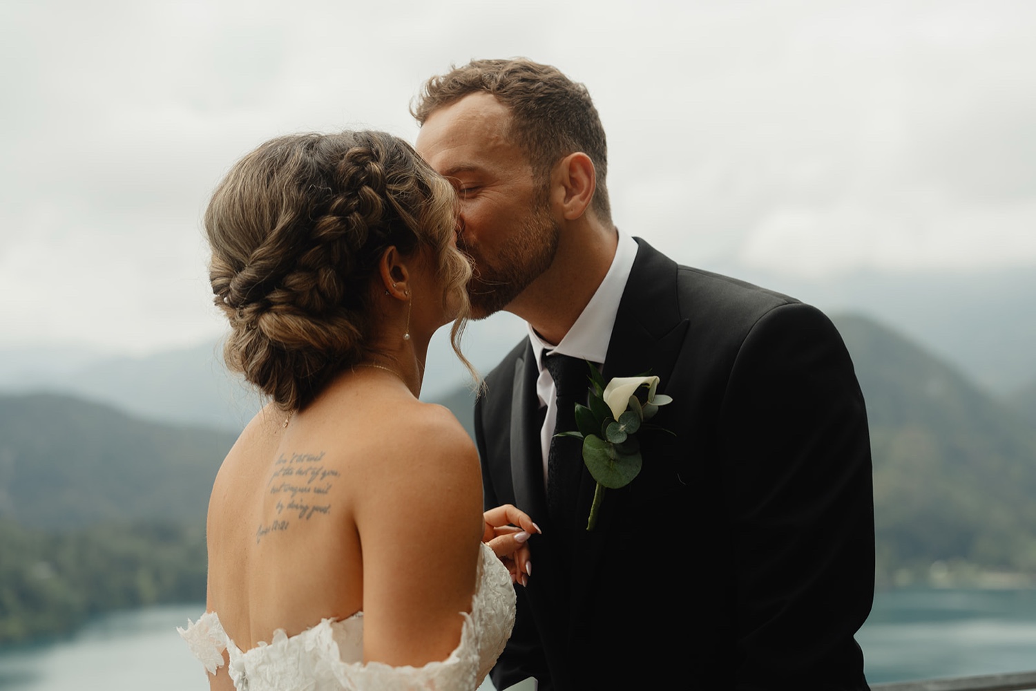 A couple kissing on the terrace of Bled Castle above Lake Bled, Slovenia