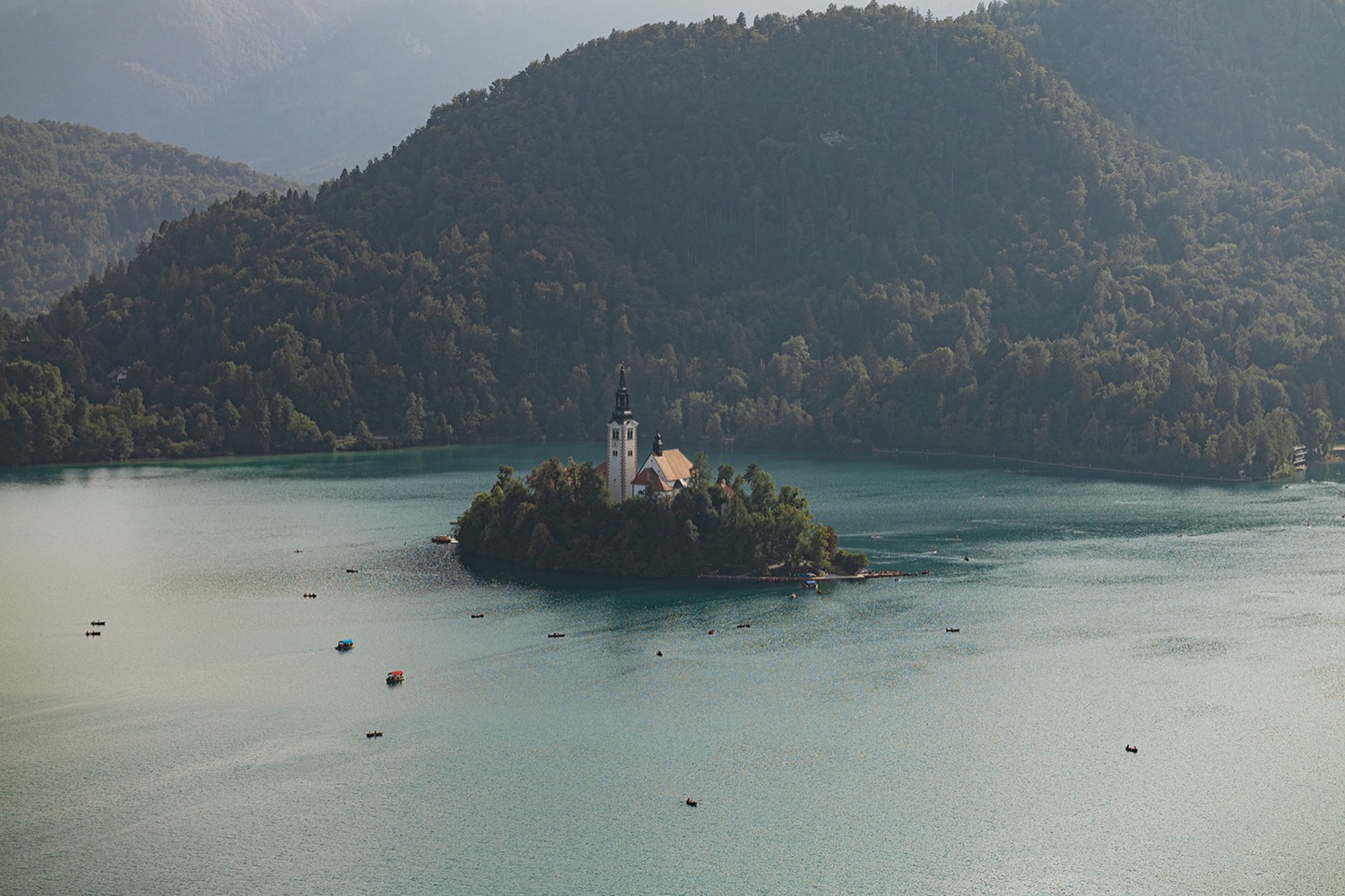 Bled Island and its church seen from Bled Castle, with Pletna boats on the lake, Slovenia