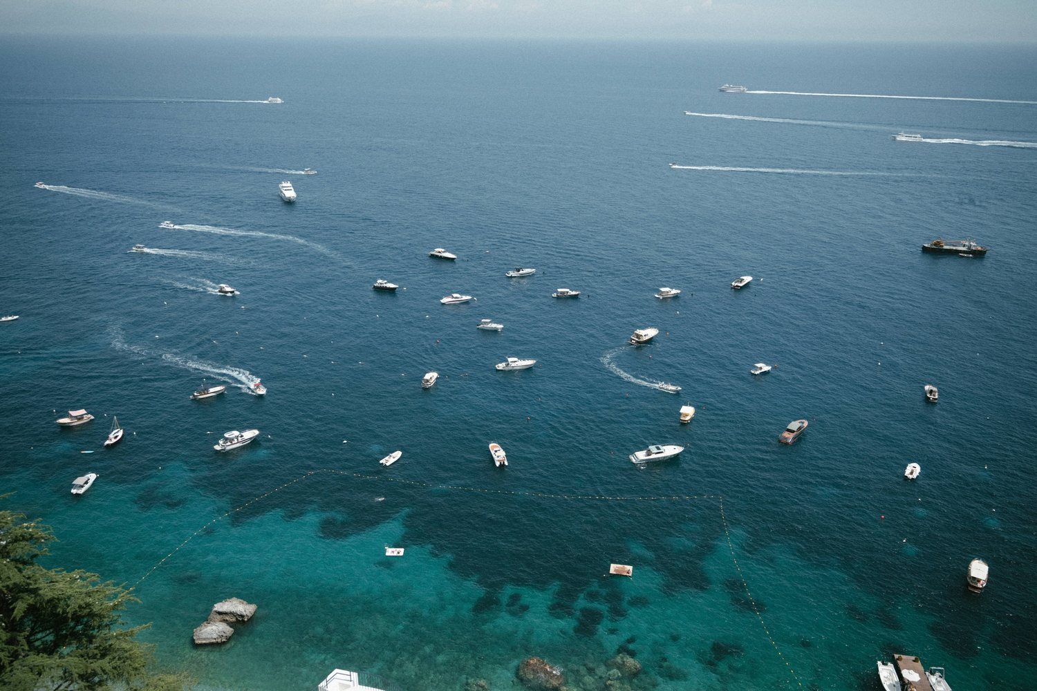 The sea in front of the hotel, with boats at anchor