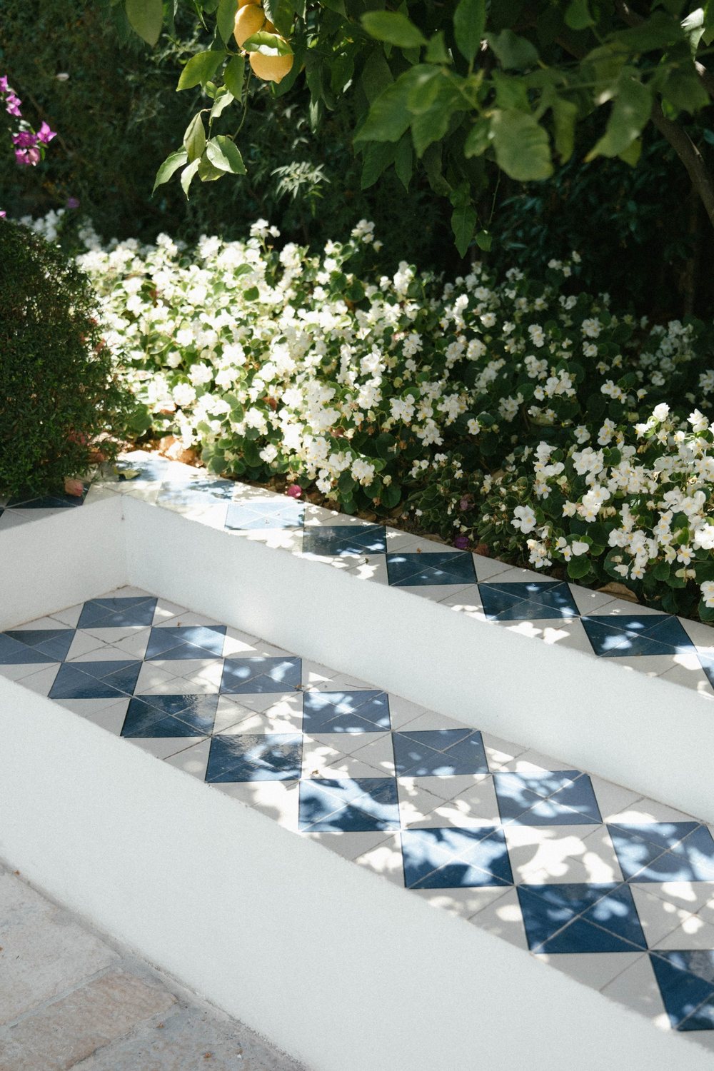 Blue and white tiles on a garden bench