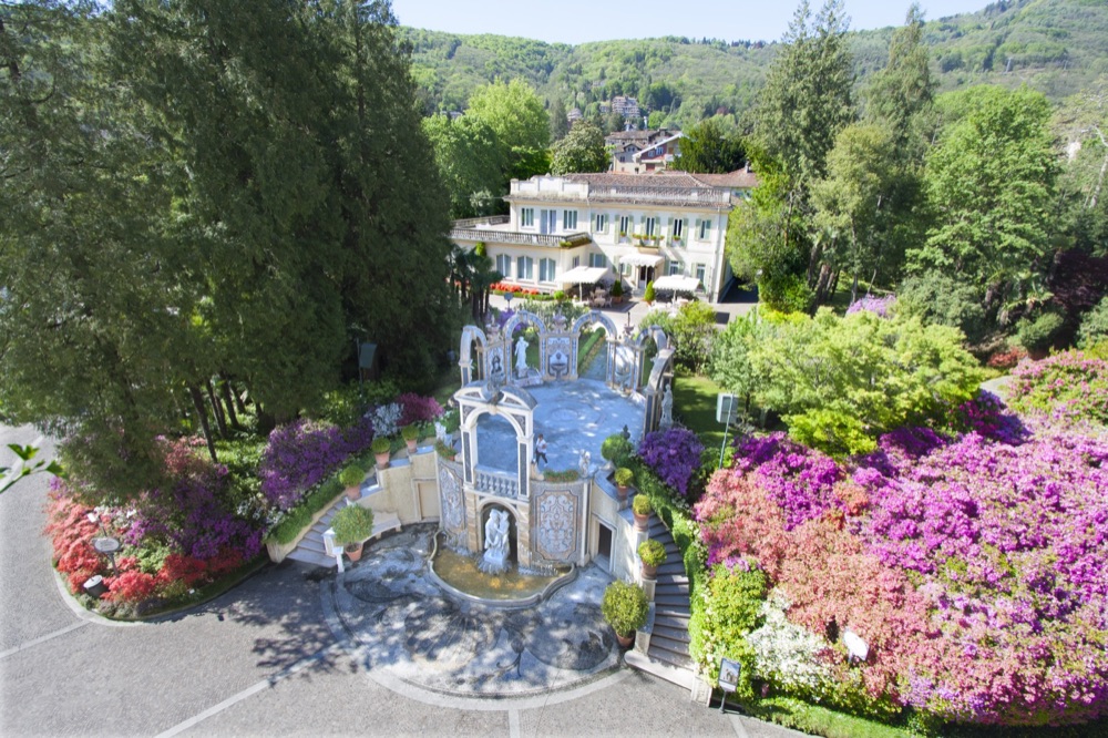 The Ninfeo terrace with its fountain and flower beds at the Grand Hotel des Iles Borromées on Lake Maggiore, Italy