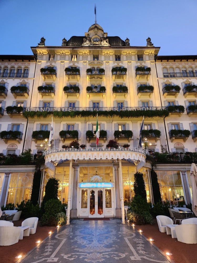 The facade of the Grand Hotel des Iles Borromées lit up at dusk in Stresa on Lake Maggiore, Italy
