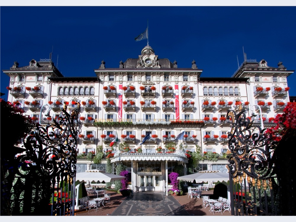 The Grand Hotel des Iles Borromées facade with red geraniums on every balcony, Stresa, Lake Maggiore