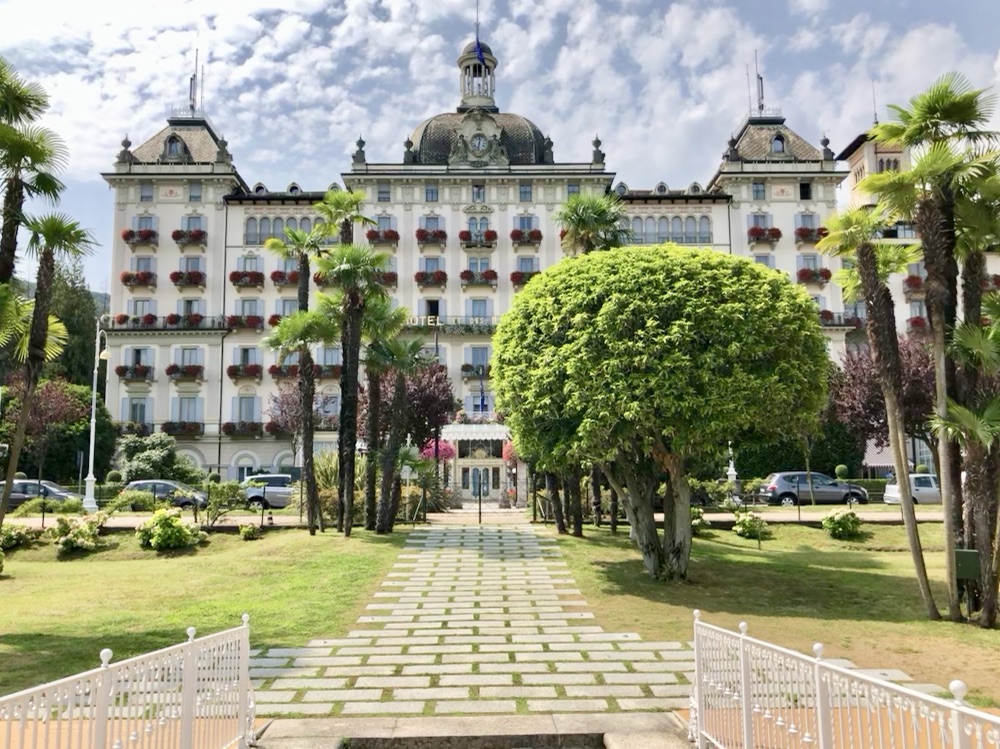 The Grand Hotel des Iles Borromées seen across its lawn and gardens in Stresa, Lake Maggiore, Italy