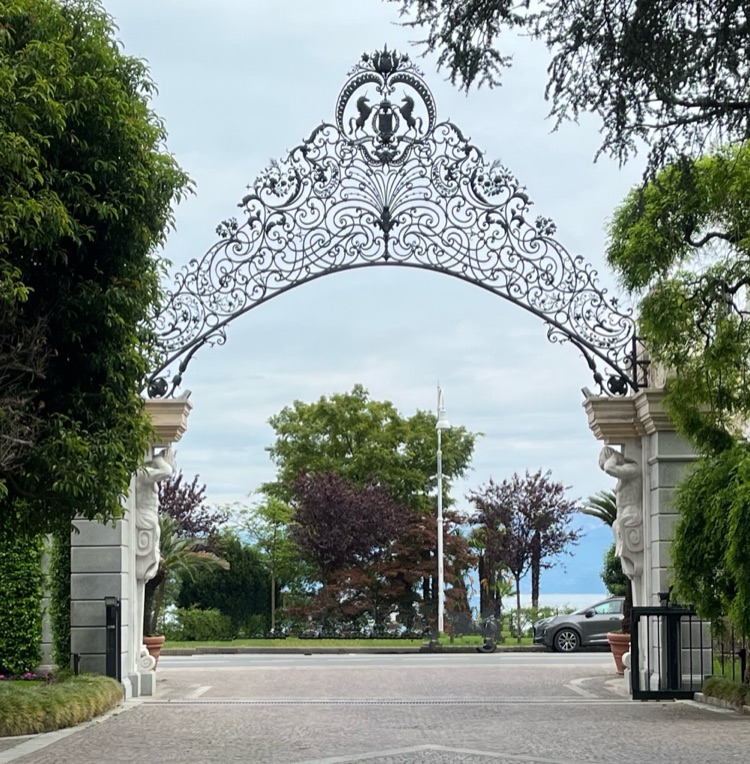 The ornate wrought-iron entrance gate of the Grand Hotel des Iles Borromées in Stresa, Italy