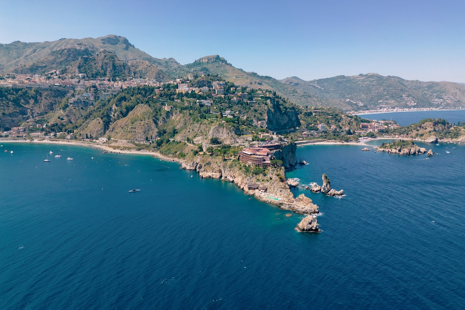 The coast of Taormina and Isola Bella from above