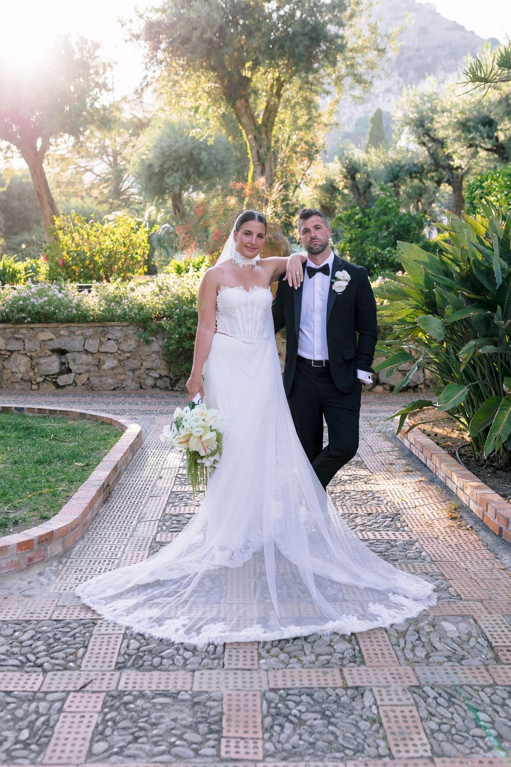 A couple among the flowerbeds of Taormina