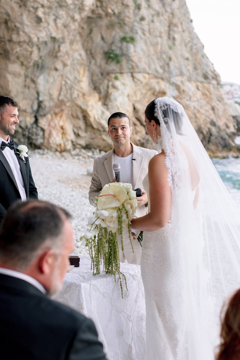 Vows on the beach below the cliffs