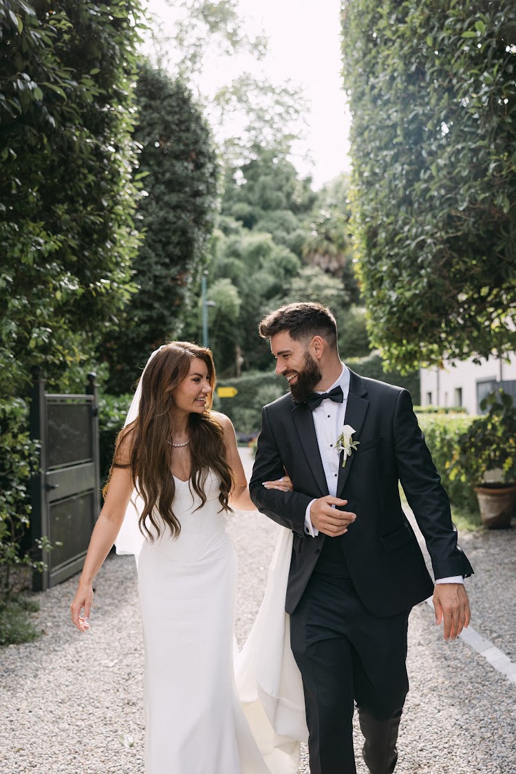 A couple walking through the gardens