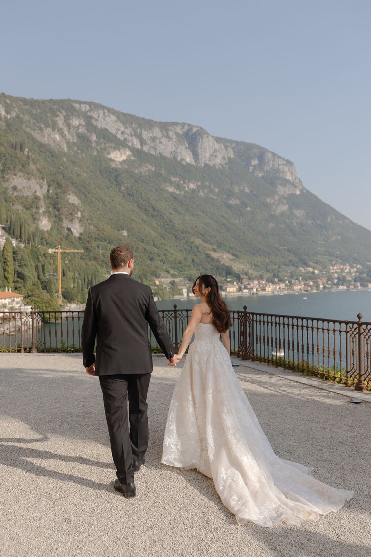 A couple walking along the lakeside terrace