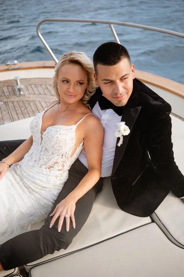 A couple on the deck of a boat off the Amalfi Coast