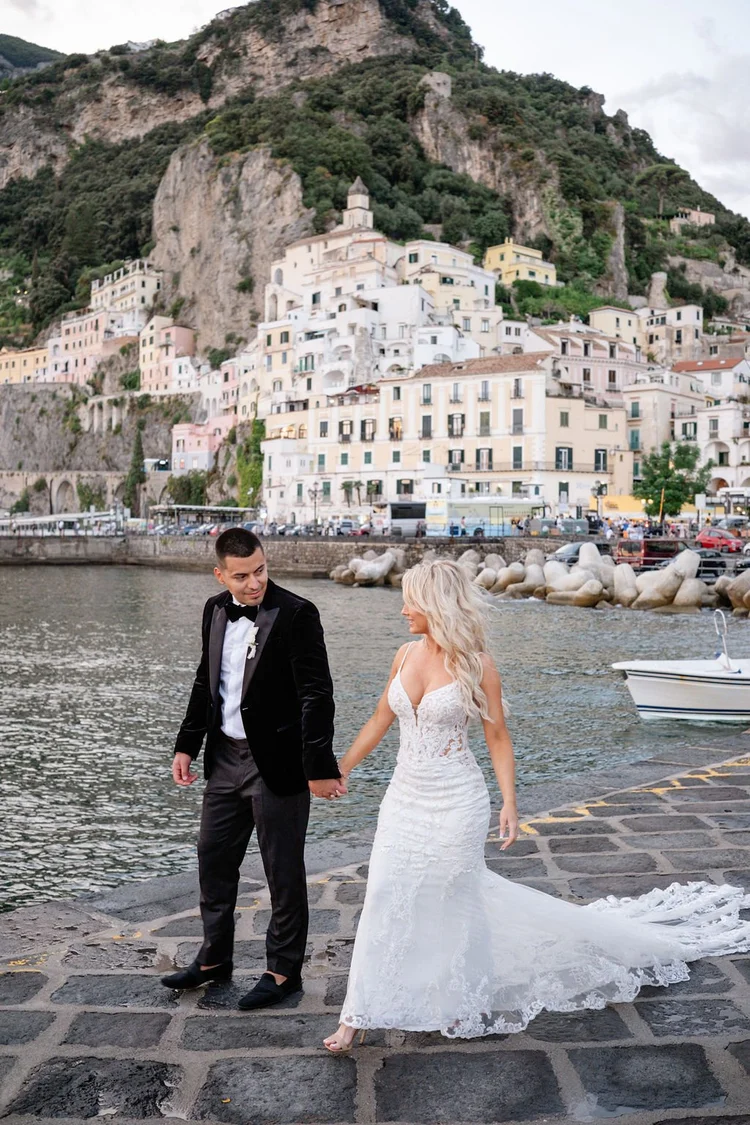 A couple on the harbor front in Amalfi