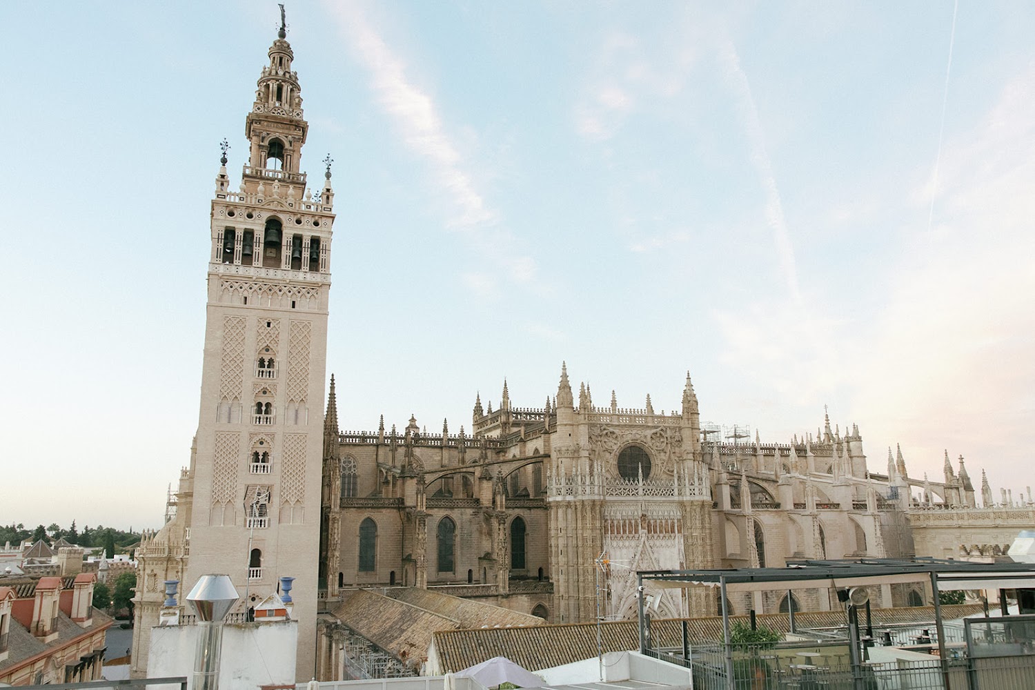 The Giralda bell tower and Seville Cathedral seen from the terrace at EME Catedral Mercer in Seville, Spain