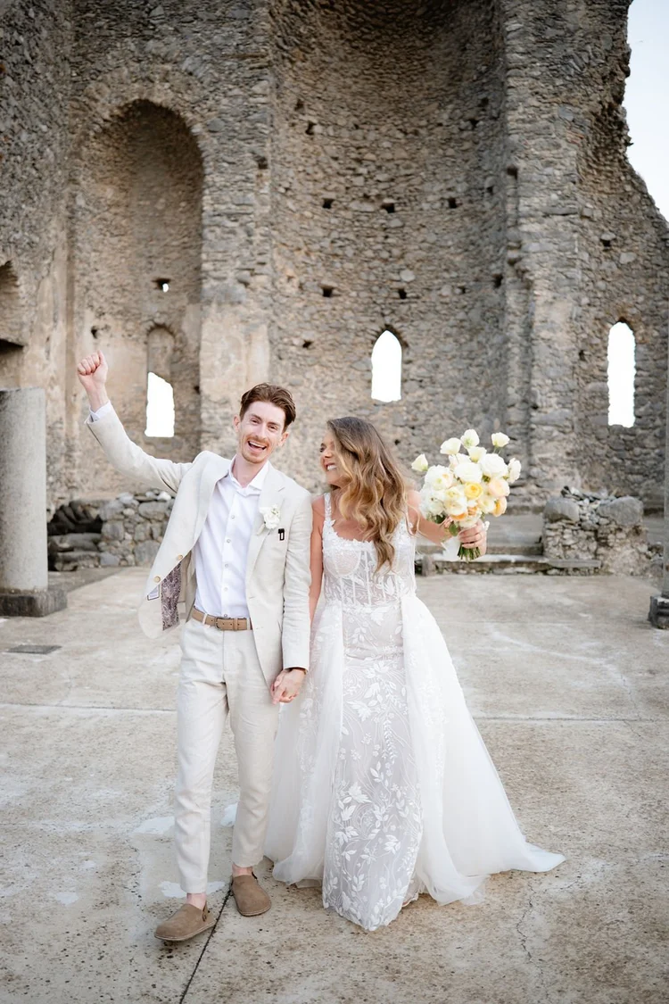 Just married, among the stone arches