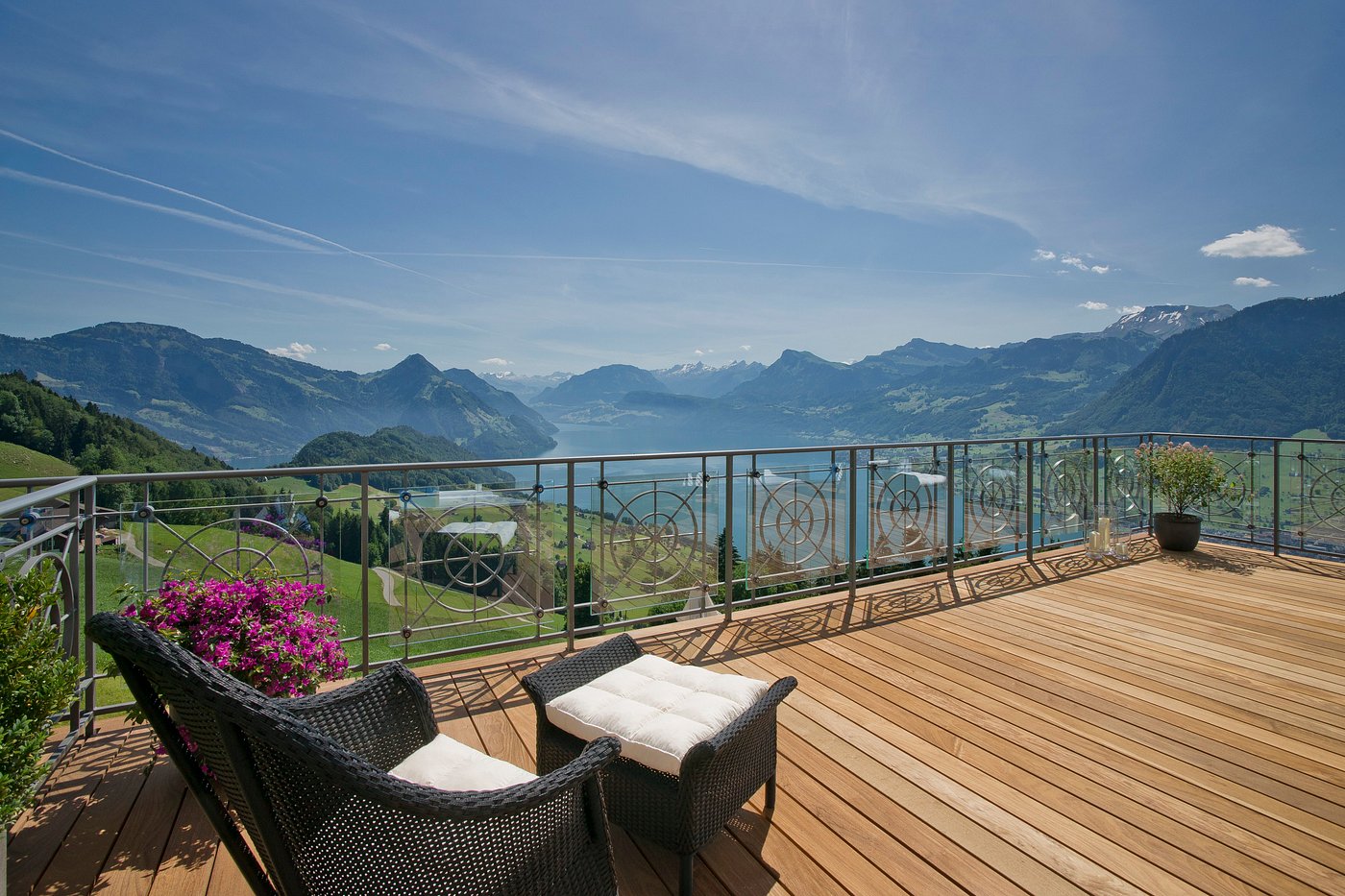Seating on a suite terrace with views of Lake Lucerne and the Alps, Switzerland elopement