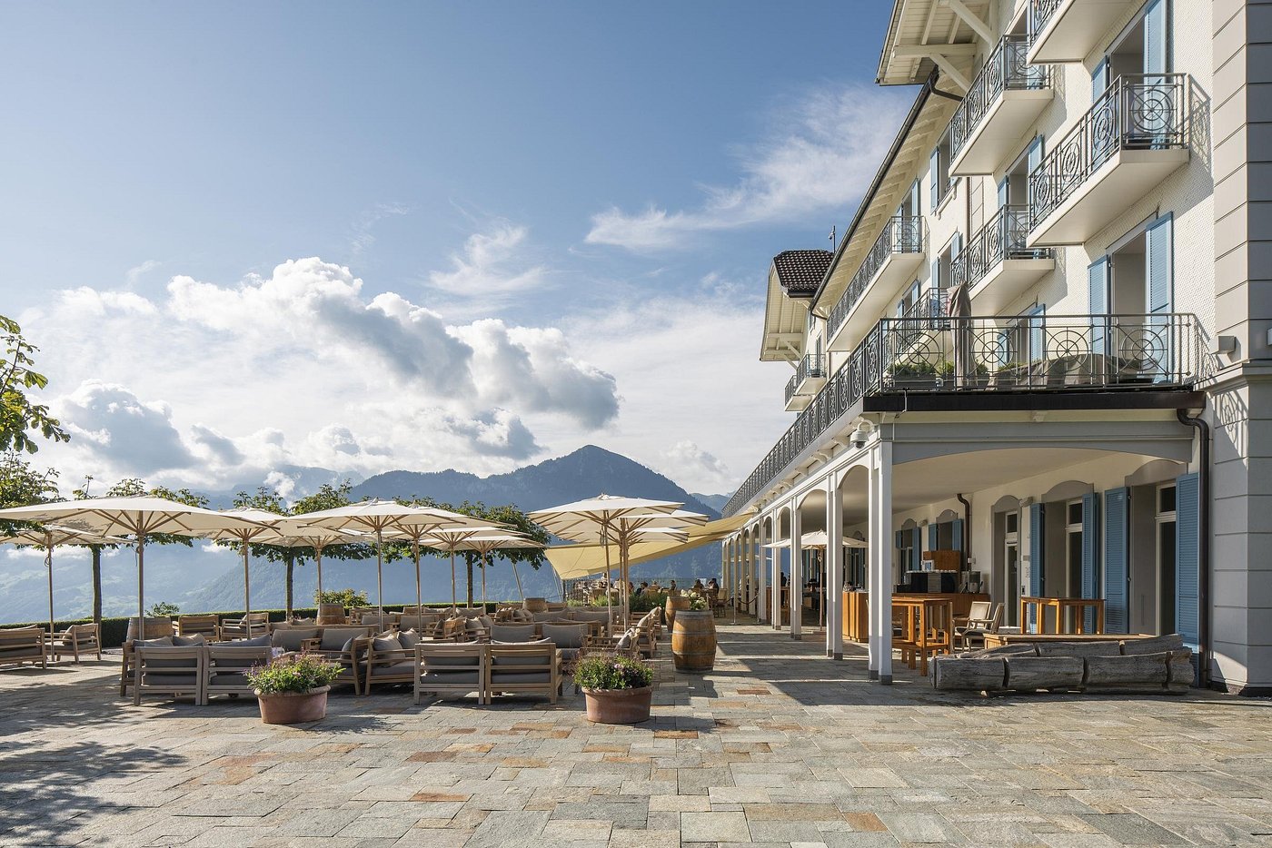 The terrace of Hotel Villa Honegg, with the mountains behind