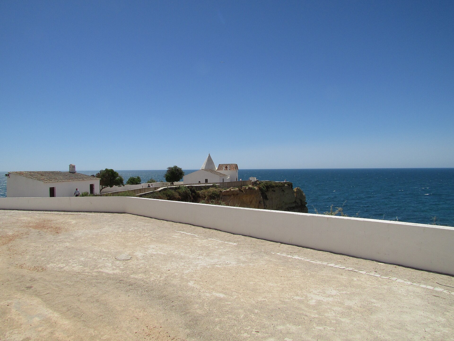 The chapel of Lady of the Rock with its terrace and the Atlantic beyond, in Porches on the Algarve coast