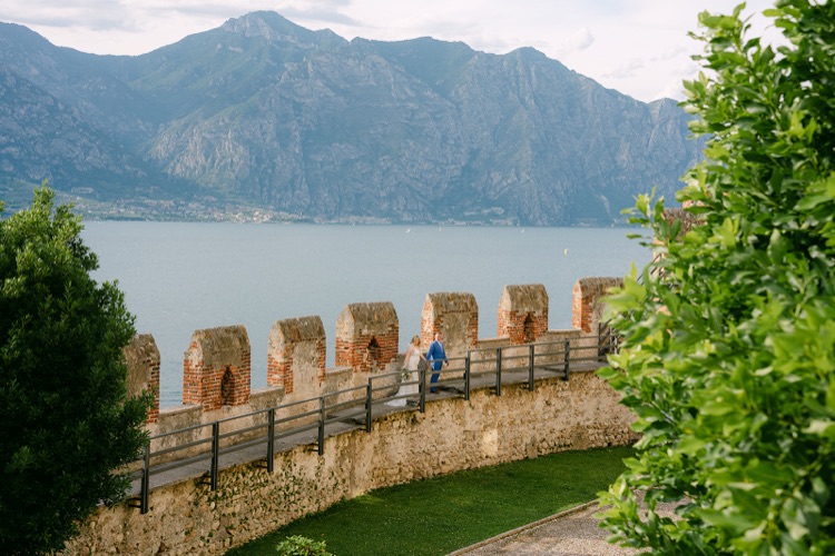 The castle ramparts of Malcesine above the blue water of Lake Garda