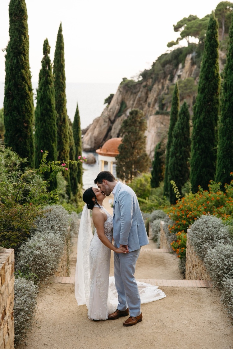 A couple kissing on a garden path among Mediterranean plants at Marimurtra Botanic Gardens, Costa Brava