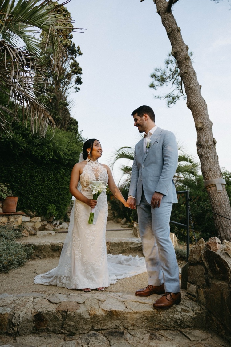 A bride and groom on the stone steps of Marimurtra Botanic Gardens in Blanes, Costa Brava