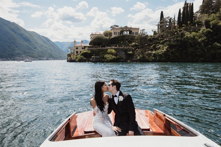 A couple on a private boat on Lake Como