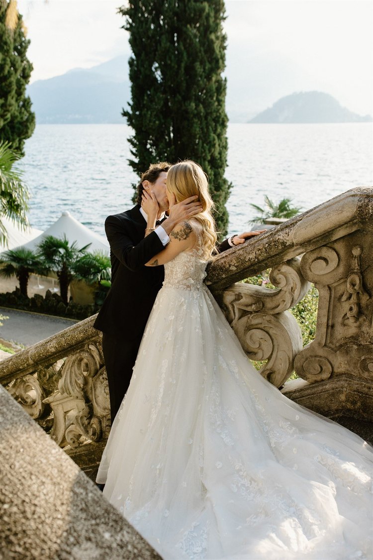 A couple on a stone staircase in the gardens