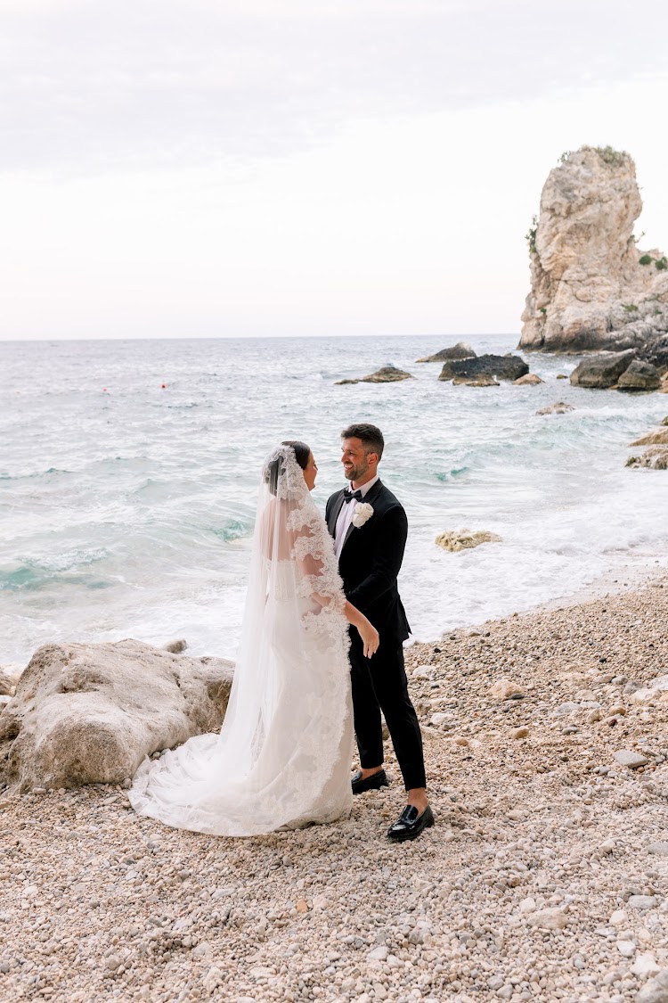 A beach ceremony below the cliffs of Taormina — already designed elopement in Italy