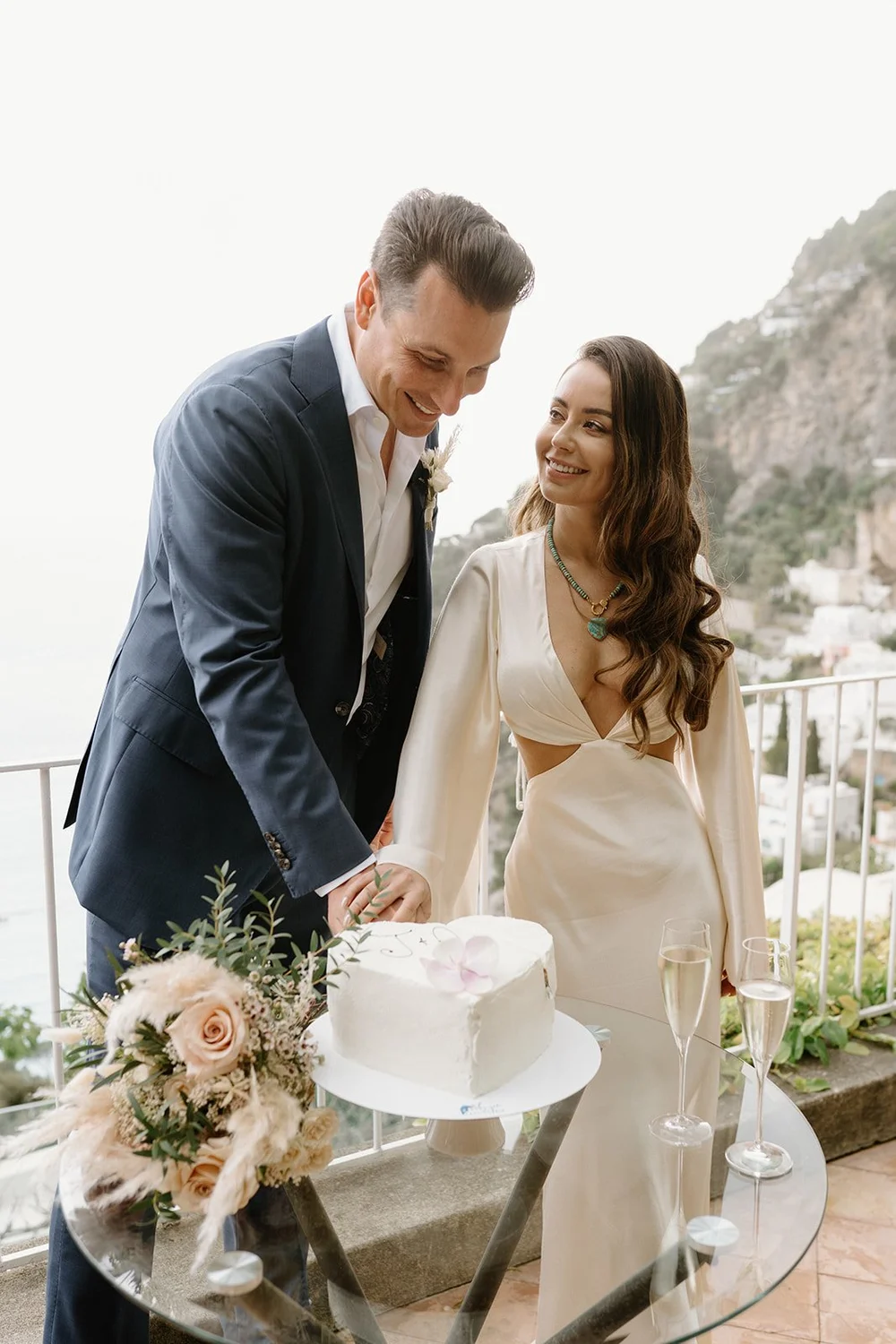 A terrace above Positano, and the sea at golden hour — already designed elopement in Italy