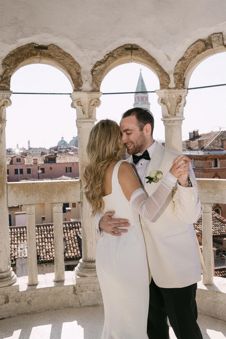 Vows at the top of a Venetian spiral tower — already designed elopement in Italy