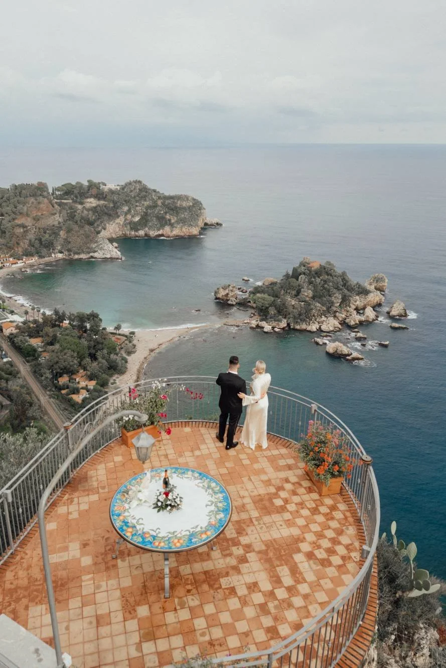 A clifftop terrace above the sea at Taormina — already designed elopement in Italy
