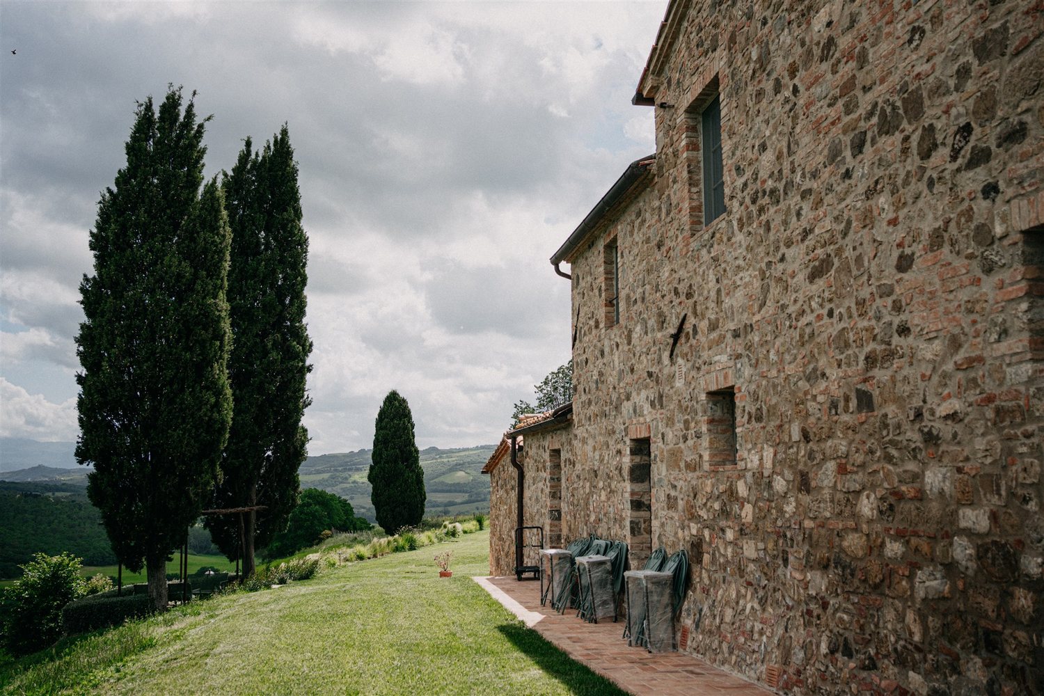 The farmhouse and its cypress trees