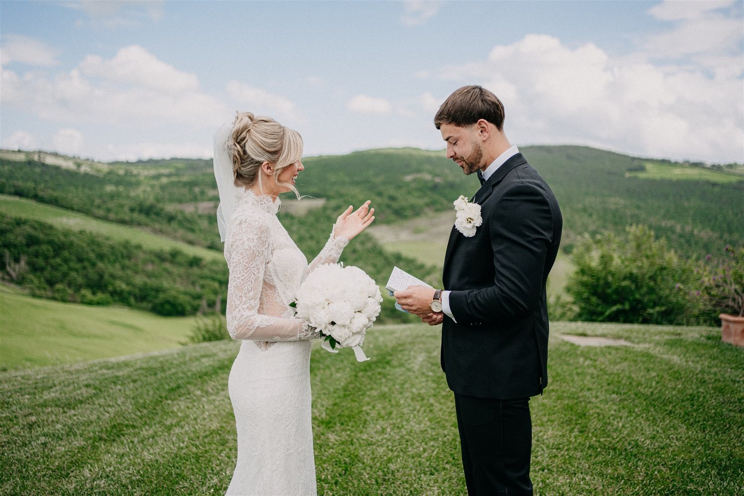 Vows on the lawn, with the Val d’Orcia behind