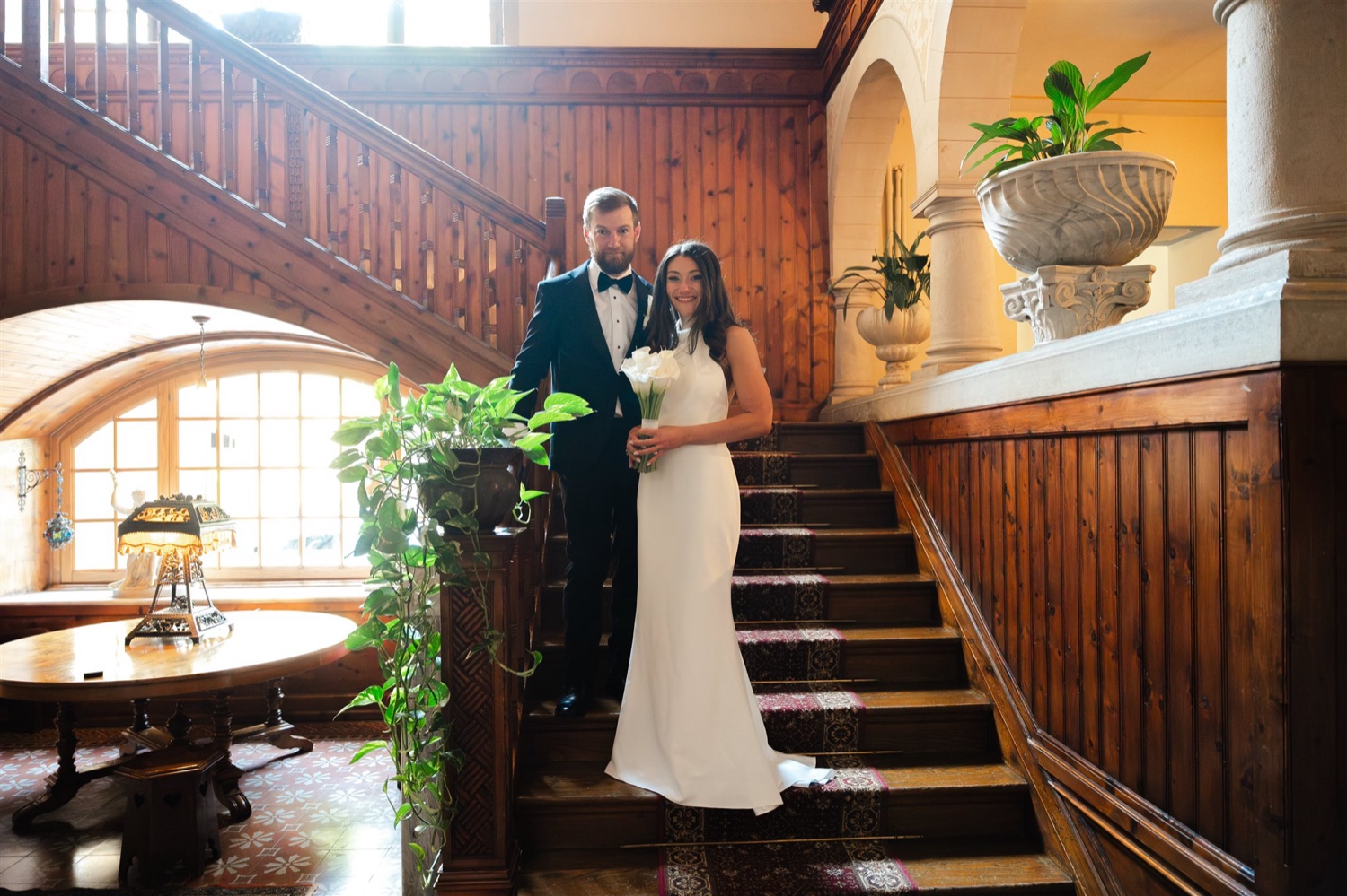 A couple on the wooden staircase of Villa del Sogno on Lake Garda