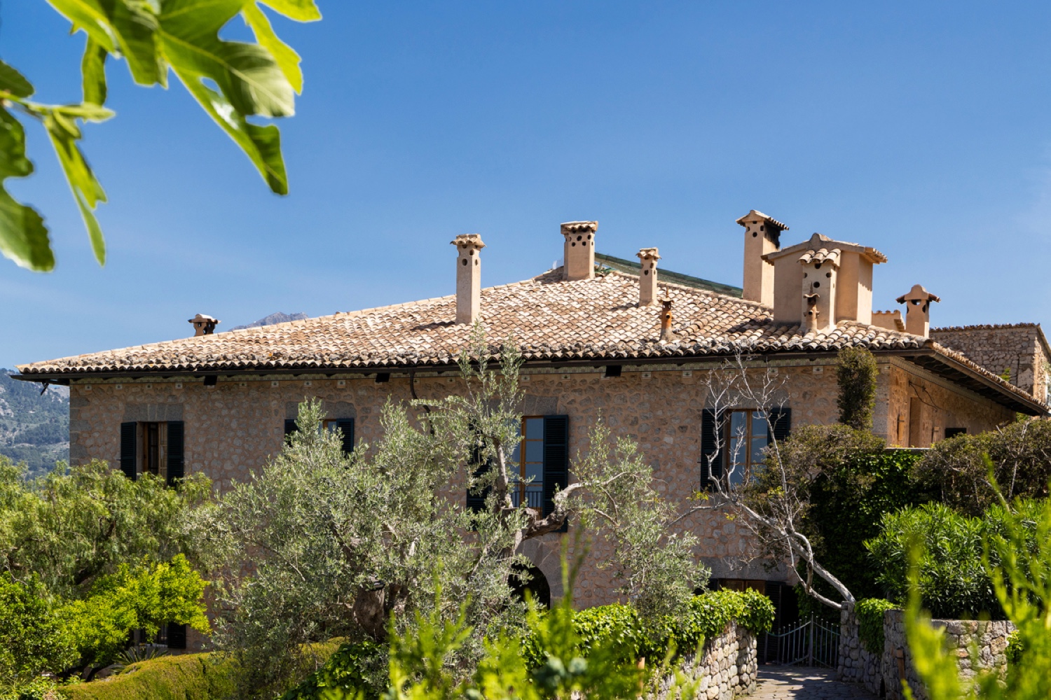 The stone finca of Ca’s Xorc in Mallorca, surrounded by its gardens and olive trees